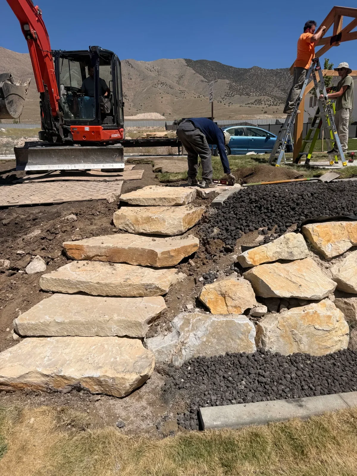 Natural stone landscape steps being installed on a Utah property