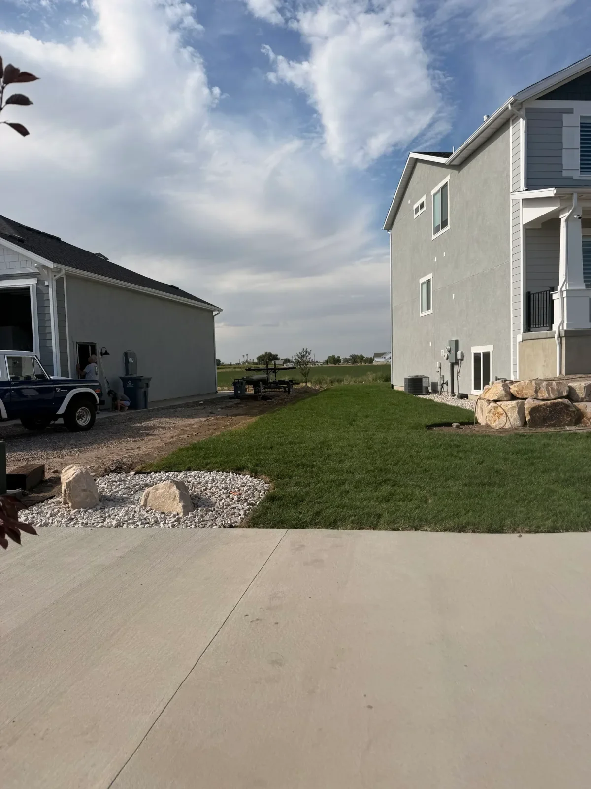 Finished client side-yard lawn and stone planting bed